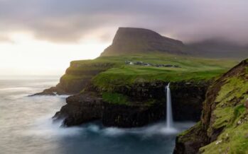 Picturesque travel destinations in Faroe Islands: Múlafossur Waterfall and the Island of Vágar
